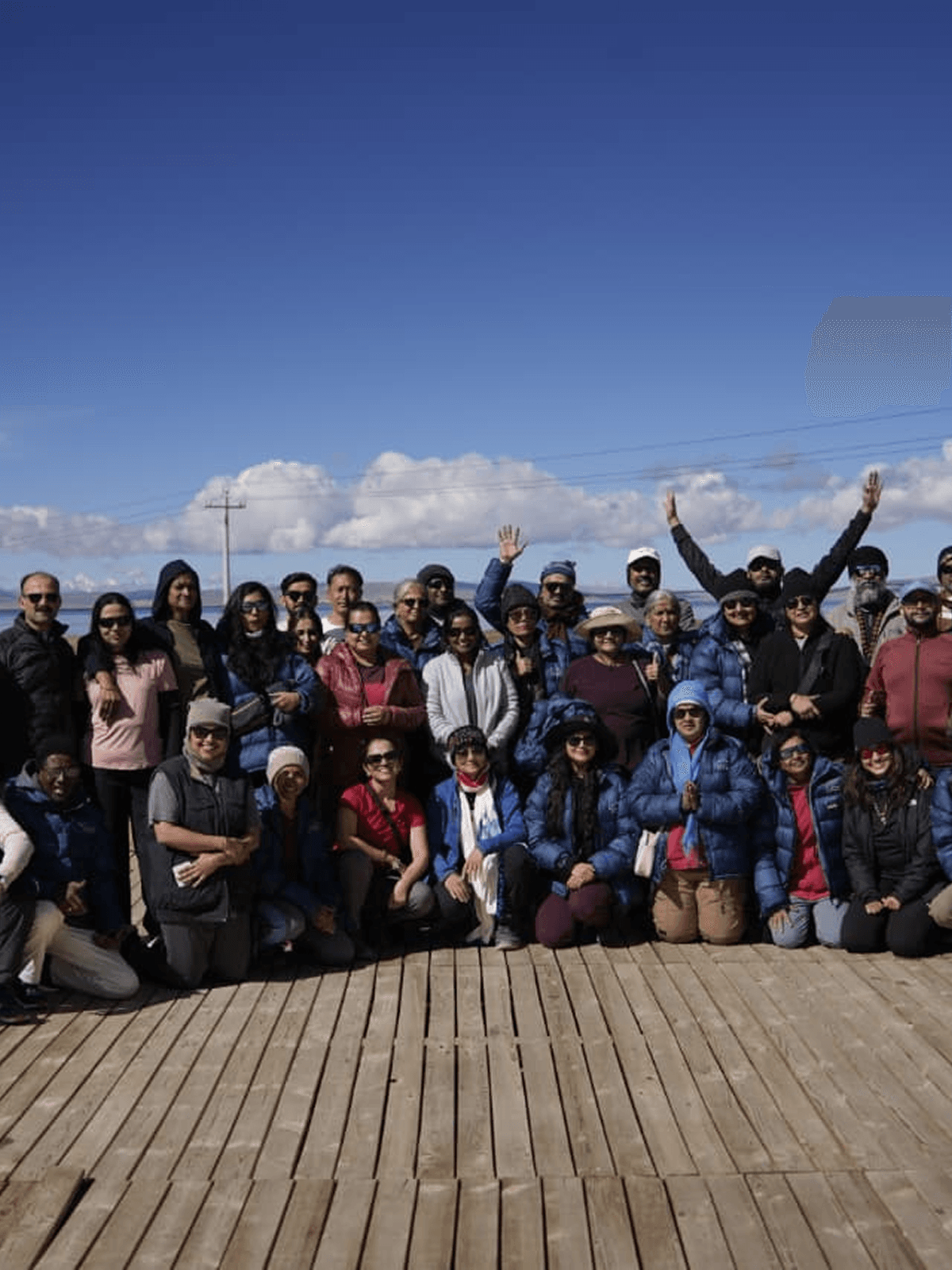 Group of travelers on a wooden deck